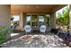 Peaceful patio with two white chairs and a small table at 28175 N 123Rd Ln, Peoria, AZ 85383