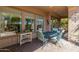 Covered patio with seating area and brick flooring at 28175 N 123Rd Ln, Peoria, AZ 85383