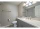 Bathroom boasts a gray vanity with a quartz countertop at 2914 E Cactus Rd, Phoenix, AZ 85032