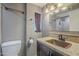 Bathroom with copper sink, granite countertop, and tiled shower at 2914 E Cactus Rd, Phoenix, AZ 85032