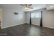 Well-lit bedroom featuring dark flooring and a ceiling fan at 2914 E Cactus Rd, Phoenix, AZ 85032