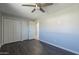 Well-lit bedroom with ceiling fan and double door closet at 2914 E Cactus Rd, Phoenix, AZ 85032