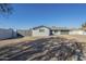 Updated ranch home with gray exterior, two-car garage, and gated driveway at 2914 E Cactus Rd, Phoenix, AZ 85032