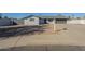 Ranch style home with gray exterior, two-car garage, and a well-manicured front yard at 2914 E Cactus Rd, Phoenix, AZ 85032