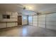 Two-car garage with built-in shelving and workbench at 2914 E Cactus Rd, Phoenix, AZ 85032