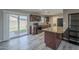 Modern kitchen with granite island and dark wood cabinetry at 2914 E Cactus Rd, Phoenix, AZ 85032