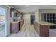 Modern kitchen with granite countertops and dark wood cabinets at 2914 E Cactus Rd, Phoenix, AZ 85032