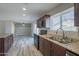 Updated kitchen with stainless steel appliances and laminate flooring at 2914 E Cactus Rd, Phoenix, AZ 85032
