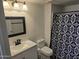 Bathroom features vanity with sink, mirror and shower at 3810 N Maryvale Pkwy # 1093, Phoenix, AZ 85031