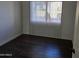 Bright bedroom with dark hardwood flooring at 3810 N Maryvale Pkwy # 1093, Phoenix, AZ 85031