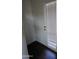 Interior entryway with a white door and dark floors at 3810 N Maryvale Pkwy # 1093, Phoenix, AZ 85031