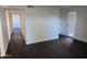 Hallway with dark floors and doors to other rooms at 3810 N Maryvale Pkwy # 1093, Phoenix, AZ 85031