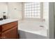 Bathroom with a bathtub and window at 3854 W Yellow Peak Dr, San Tan Valley, AZ 85144