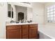 Bathroom with double vanity and bathtub at 3854 W Yellow Peak Dr, San Tan Valley, AZ 85144