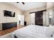 Spacious bedroom with wood flooring and sliding barn door at 3854 W Yellow Peak Dr, San Tan Valley, AZ 85144