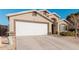 Tan house with white garage door and landscaping at 3854 W Yellow Peak Dr, San Tan Valley, AZ 85144