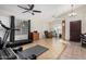 Home gym with treadmill, weights, and wood wall at 3854 W Yellow Peak Dr, San Tan Valley, AZ 85144