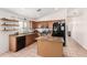 Kitchen with island, stainless steel appliances, and wood cabinets at 3854 W Yellow Peak Dr, San Tan Valley, AZ 85144