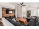 Spacious living room with sectional sofa and wood-paneled wall at 3854 W Yellow Peak Dr, San Tan Valley, AZ 85144
