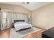 Spacious main bedroom with king-size bed and barn door at 3854 W Yellow Peak Dr, San Tan Valley, AZ 85144