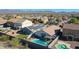 Aerial view showcasing a house with solar panels, a pool, and a large backyard at 3884 N 294Th Ln, Buckeye, AZ 85396