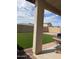 Landscaped backyard with artificial turf and patio at 42244 W Calle St, Maricopa, AZ 85138