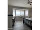 Spacious bedroom with tile floors and large windows at 42244 W Calle St, Maricopa, AZ 85138