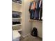 Walk-in closet with ample shelving and hanging space at 42244 W Calle St, Maricopa, AZ 85138