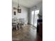 Bright dining area with table, chairs, and sliding glass door at 42244 W Calle St, Maricopa, AZ 85138