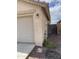 Attached garage with light fixture and exterior electrical panel at 42244 W Calle St, Maricopa, AZ 85138