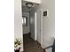 Bright hallway with light-colored walls and wood-look floors at 42244 W Calle St, Maricopa, AZ 85138