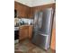 Stainless steel French-door refrigerator in the kitchen at 42244 W Calle St, Maricopa, AZ 85138