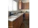 Kitchen sink with double basin and wood cabinets at 42244 W Calle St, Maricopa, AZ 85138