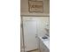 Laundry room with washer, dryer and door access at 42244 W Calle St, Maricopa, AZ 85138