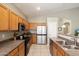 Kitchen with stainless steel appliances and wood cabinets at 4434 E Desert Wind Dr, Phoenix, AZ 85044