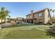 Landscaped backyard oasis with putting green and spacious patio at 6302 E Monte Cristo Ave, Scottsdale, AZ 85254