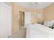 Spacious bedroom with a comfortable bed and access to hallway at 6302 E Monte Cristo Ave, Scottsdale, AZ 85254