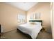 Spacious bedroom with a king-size bed and large window at 6302 E Monte Cristo Ave, Scottsdale, AZ 85254