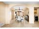Elegant dining area with chandelier and arched entryway at 6302 E Monte Cristo Ave, Scottsdale, AZ 85254