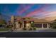 Beautiful two-story home with stone accents and a three-car garage at 6302 E Monte Cristo Ave, Scottsdale, AZ 85254