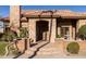 Inviting front entry with stone detailing and fountain at 6302 E Monte Cristo Ave, Scottsdale, AZ 85254