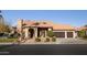 Beautiful two-story home with a tile roof and landscaped yard at 6302 E Monte Cristo Ave, Scottsdale, AZ 85254