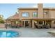 Home exterior with pool, patio furniture, and covered seating at 6302 E Monte Cristo Ave, Scottsdale, AZ 85254