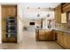 Spacious kitchen with island, stainless steel appliances, and wood cabinets at 6302 E Monte Cristo Ave, Scottsdale, AZ 85254
