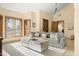 Relaxing living area with sectional sofa and ottoman at 6302 E Monte Cristo Ave, Scottsdale, AZ 85254