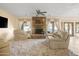 Relaxing living room with stone fireplace and comfortable seating area at 6302 E Monte Cristo Ave, Scottsdale, AZ 85254