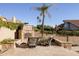 Stone patio with fireplace and comfortable seating at 6302 E Monte Cristo Ave, Scottsdale, AZ 85254