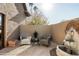 Relaxing patio featuring two wicker chairs and a stone fountain at 6302 E Monte Cristo Ave, Scottsdale, AZ 85254