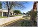 Landscaped backyard with a view of neighboring homes at 649 S Arrowwood Way, Mesa, AZ 85208