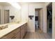 Bathroom features a double vanity and a shower/tub combo at 649 S Arrowwood Way, Mesa, AZ 85208